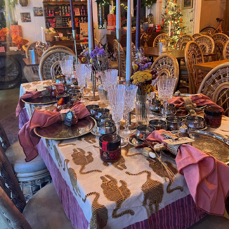 A catered table laid with candles and glassware